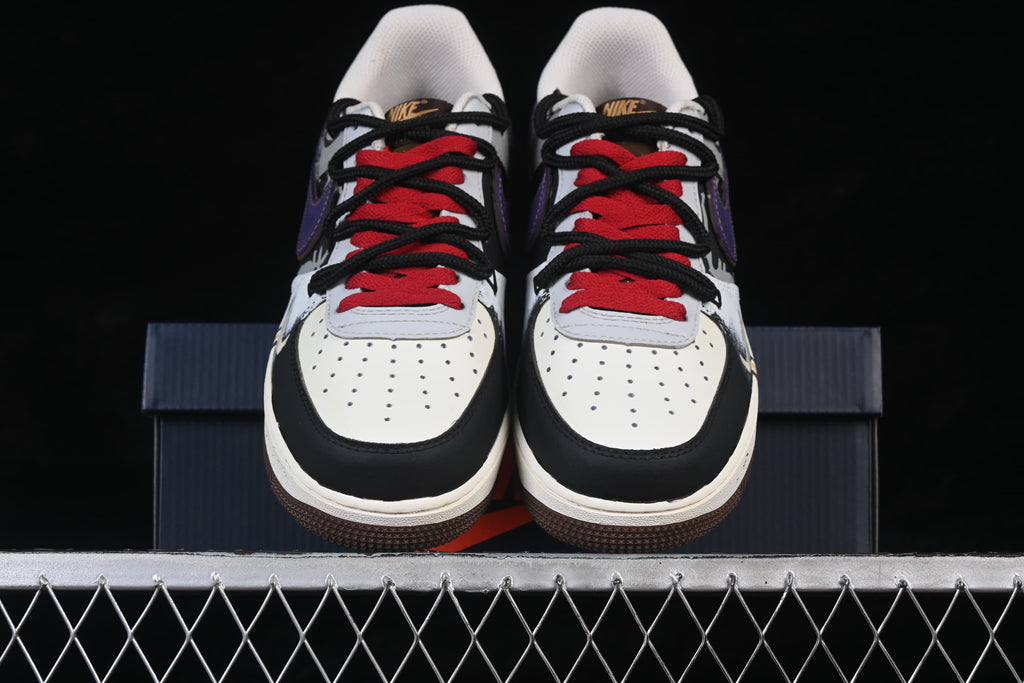 Front view of the pair with red and black laces and perforated toes