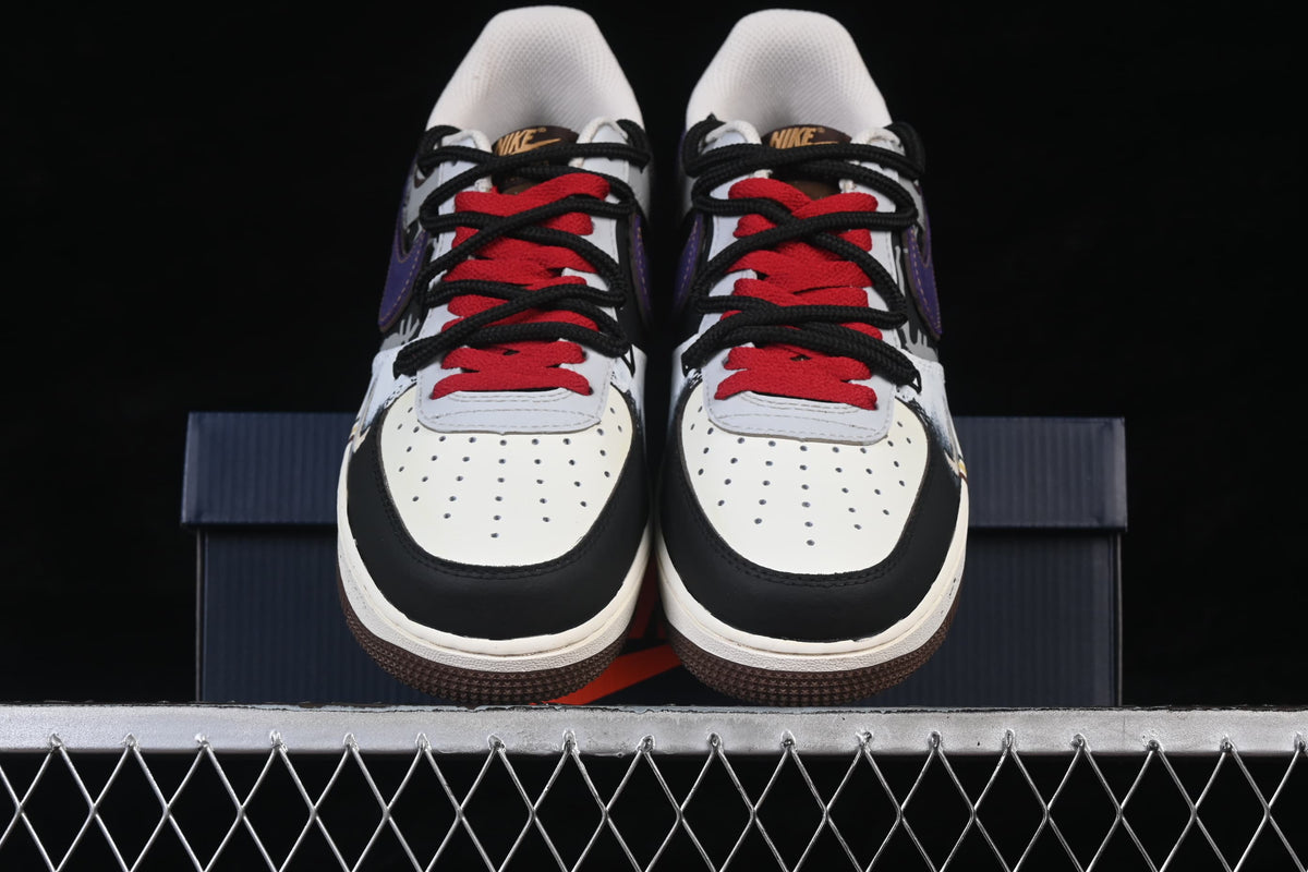 Front view of the pair with red and black laces and perforated toes