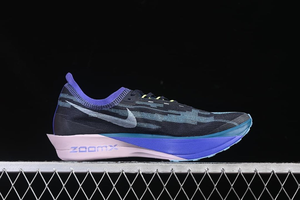 Side profile highlighting the dark patterned upper and blue-violet sole.