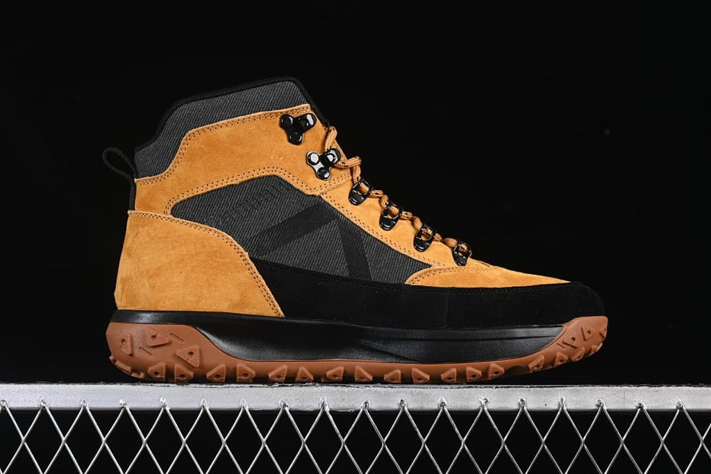 Side profile of the wheat and black high-top boot