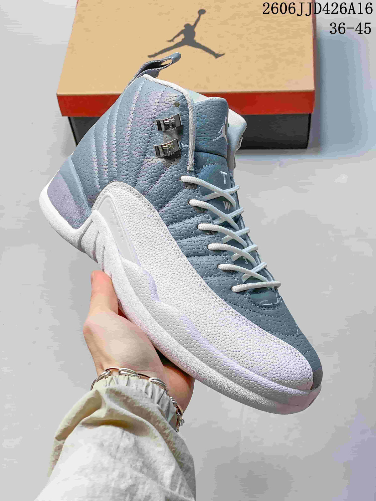 Close-up of a gray and white high-top sneaker showing its textured panels and lacing