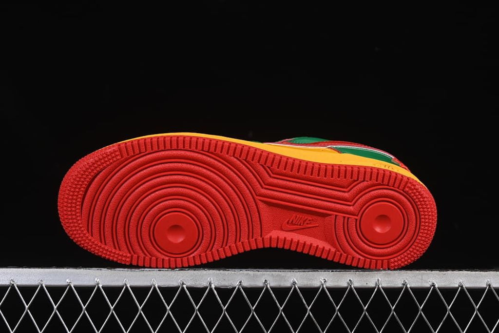 Underside view showing the red patterned outsoles