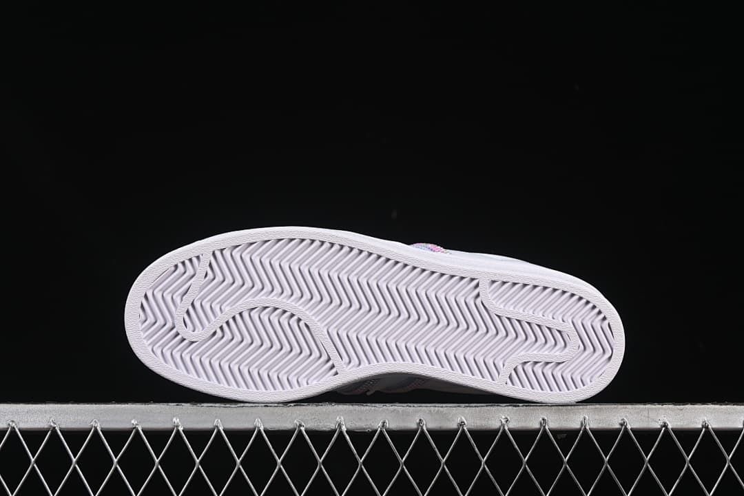 Underside view showing the sneakers' patterned outsoles