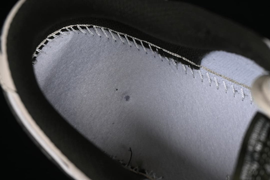 Close-up inside the sneaker showing interior stitching
