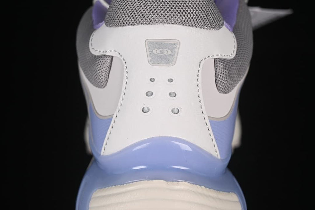 Rear view highlighting the heel details and lavender-blue accents.