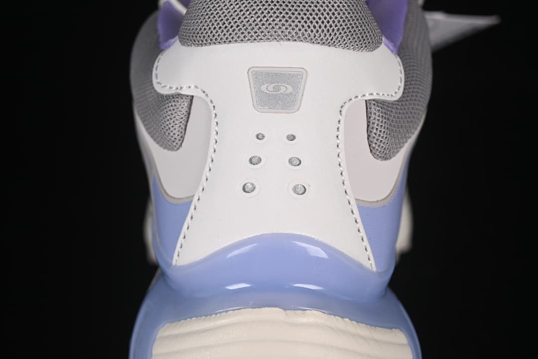 Rear view highlighting the heel details and lavender-blue accents.