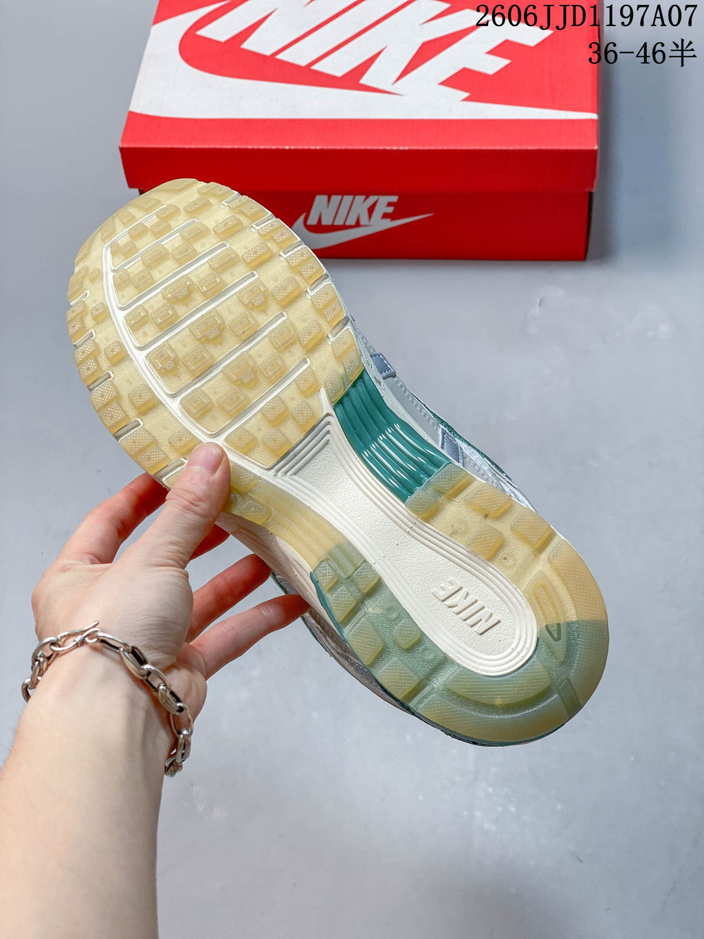 Close-up of the sneaker outsole with translucent tinted tread and teal accents