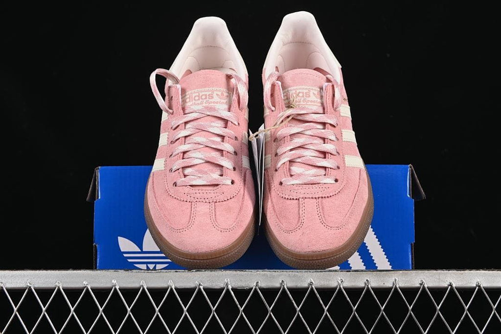 Front view of the pair placed on an adidas box