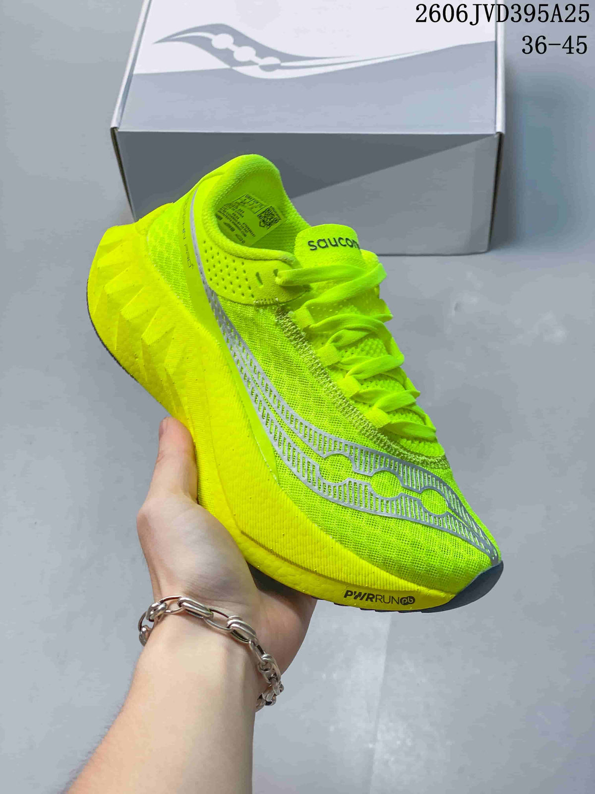 Close-up of a bright neon yellow Saucony Endorphin Speed 5 shoe with gray details.
