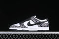 Side view of black-and-white Nike SB Dunk Low sneakers with repeating NY print on the overlays.