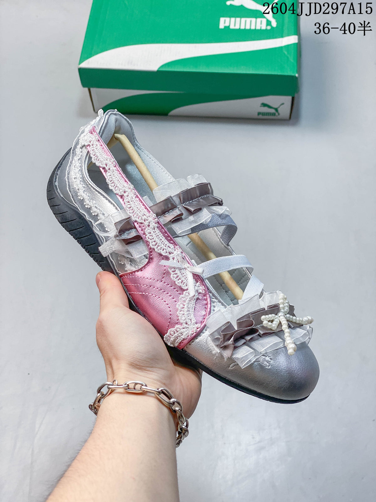 Side view of a silver and pink embellished low-profile sneaker
