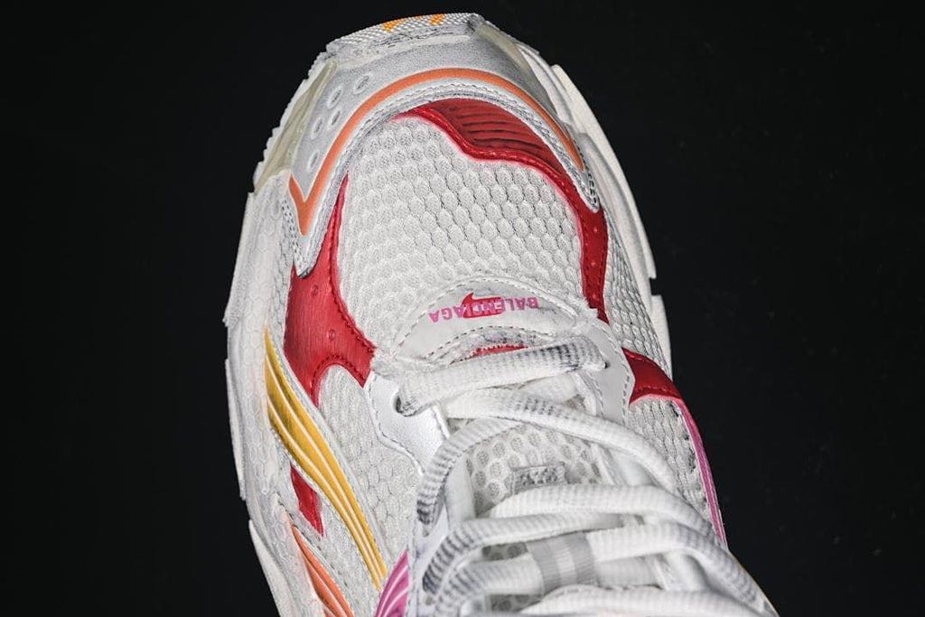 Top-down close-up of the sneaker toe and lace area