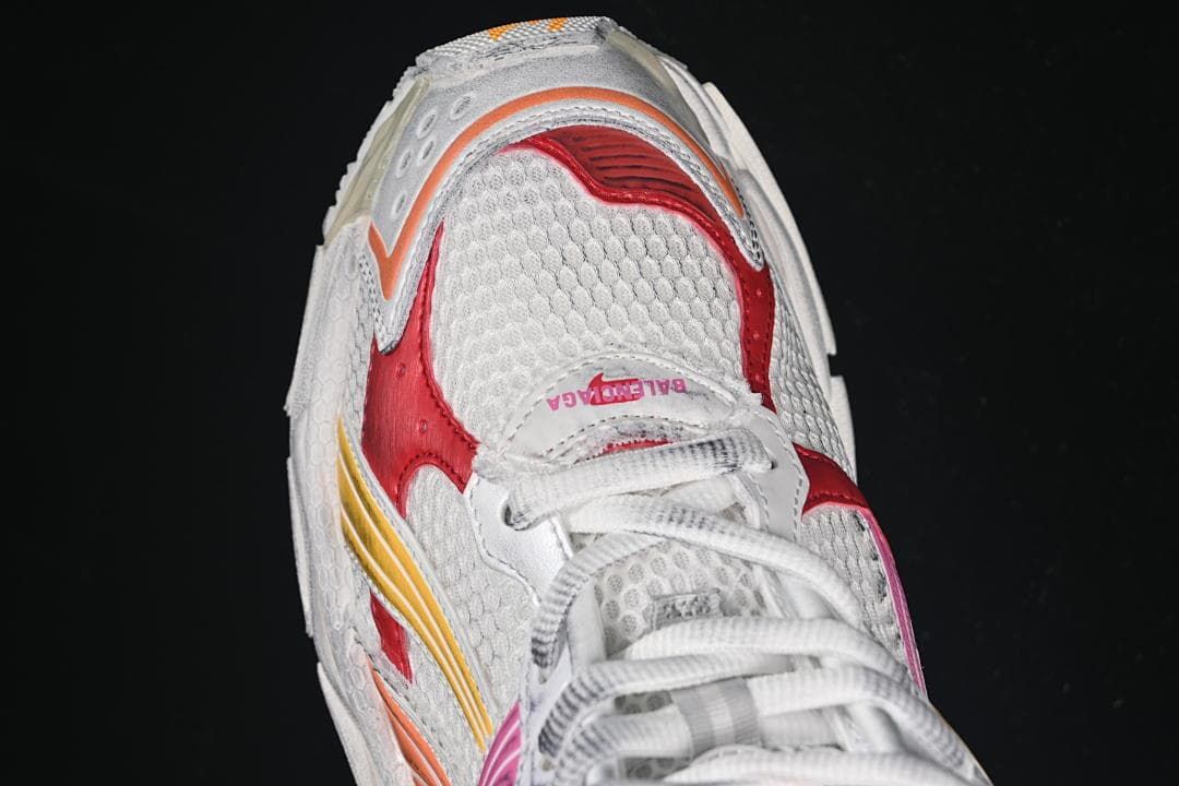 Top-down close-up of the sneaker toe and lace area