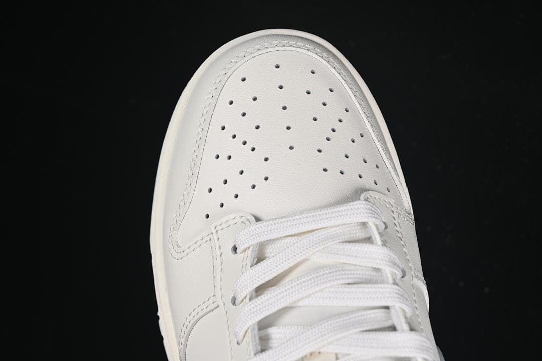 Top view of the perforated toe and white laces