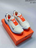 Pair of light gray Nike InfinityRN 4 running shoes with bright orange laces, dark blue accents, and an orange shoebox.