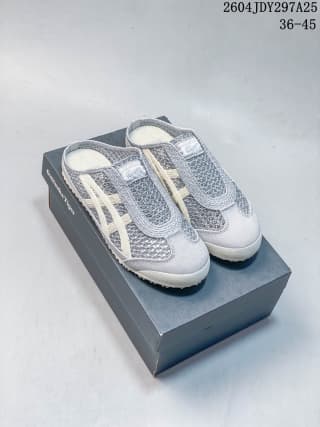 Pair of grey and white Onitsuka Tiger Mexico 66 Sabot slip-on sneakers displayed on their shoebox.