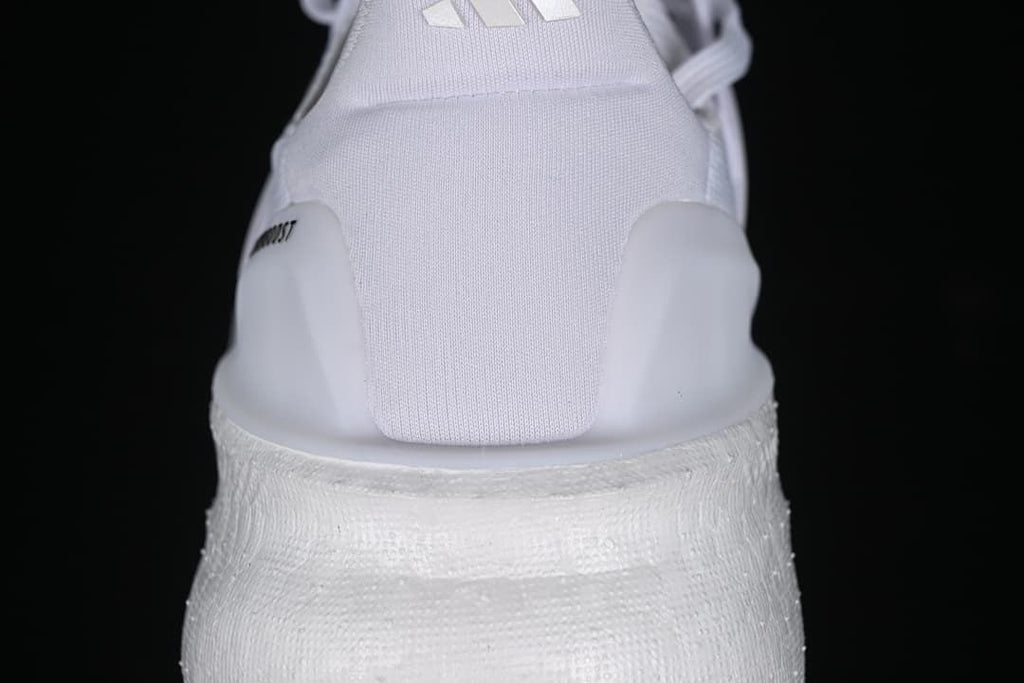Rear view highlighting the heel and thick white midsole.