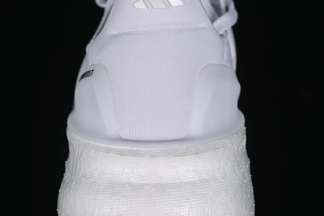 Rear view highlighting the heel and thick white midsole.