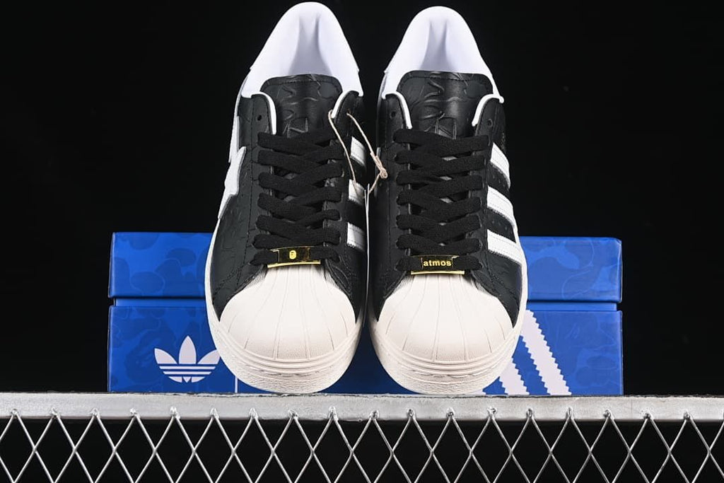 Front view of both sneakers showing the shell toes and lace details