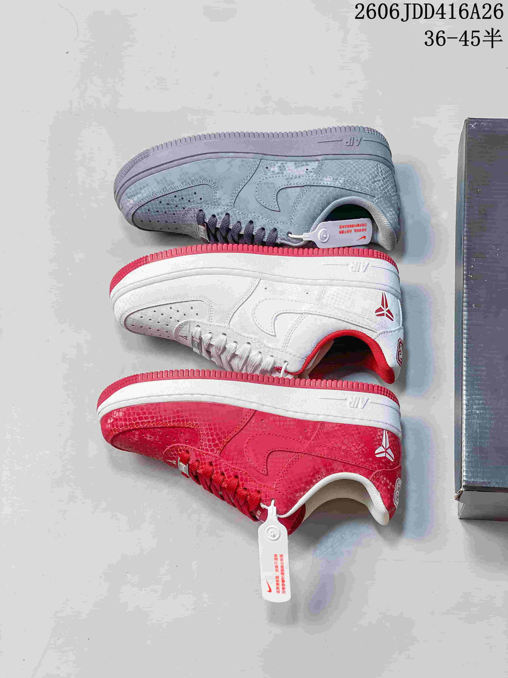 Three low-top sneaker colorways shown from the side: gray-toned, white with red accents, and red.