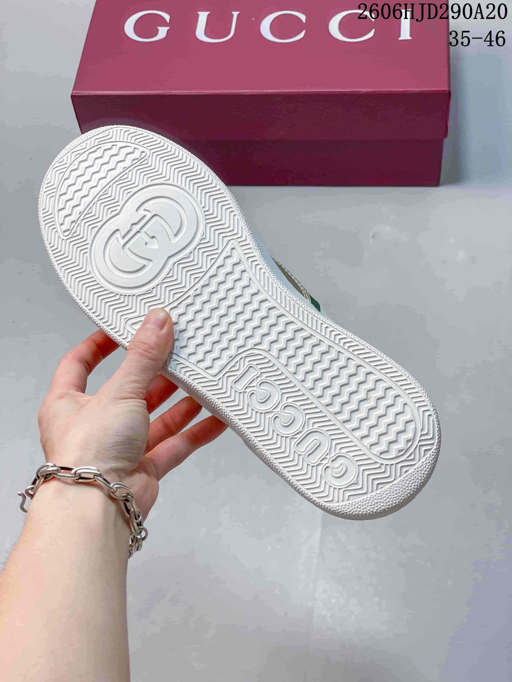 Underside view showing the textured white sneaker sole