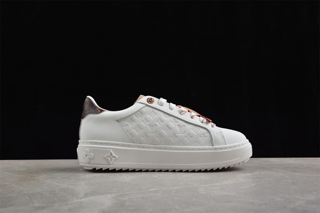Side profile showing the embossed panel and sawtooth-style outsole