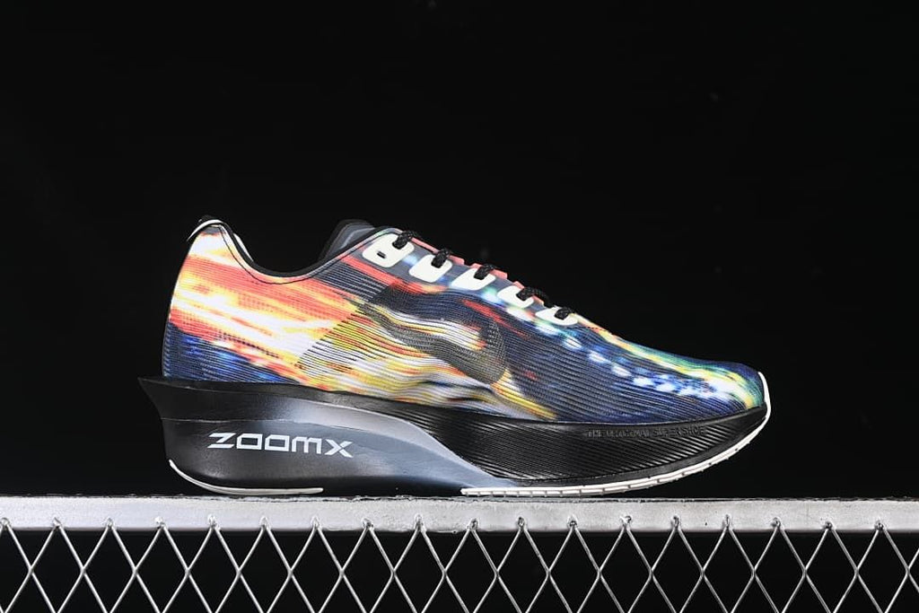 Side view of the multicolor shoe with ZoomX lettering on the midsole