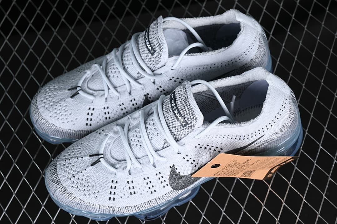 Pair of white and gray VaporMax sneakers shown from above at an angle.