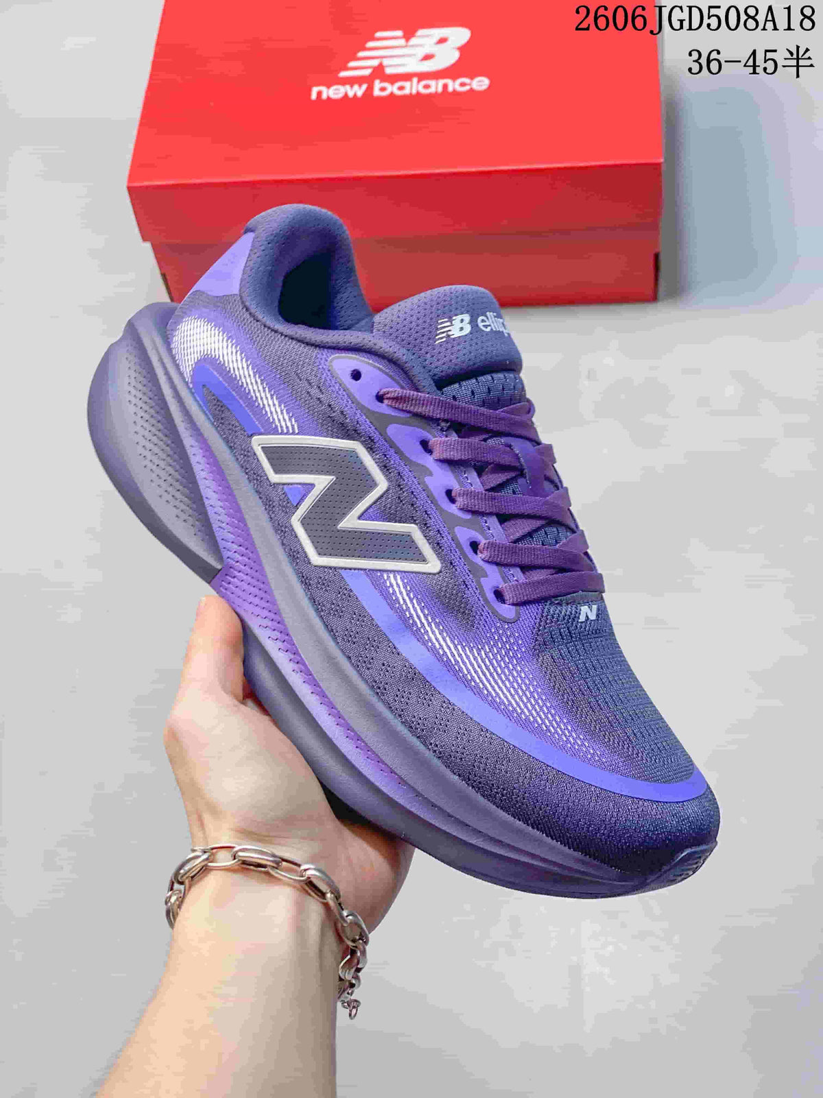 Angled side view of the purple running shoe