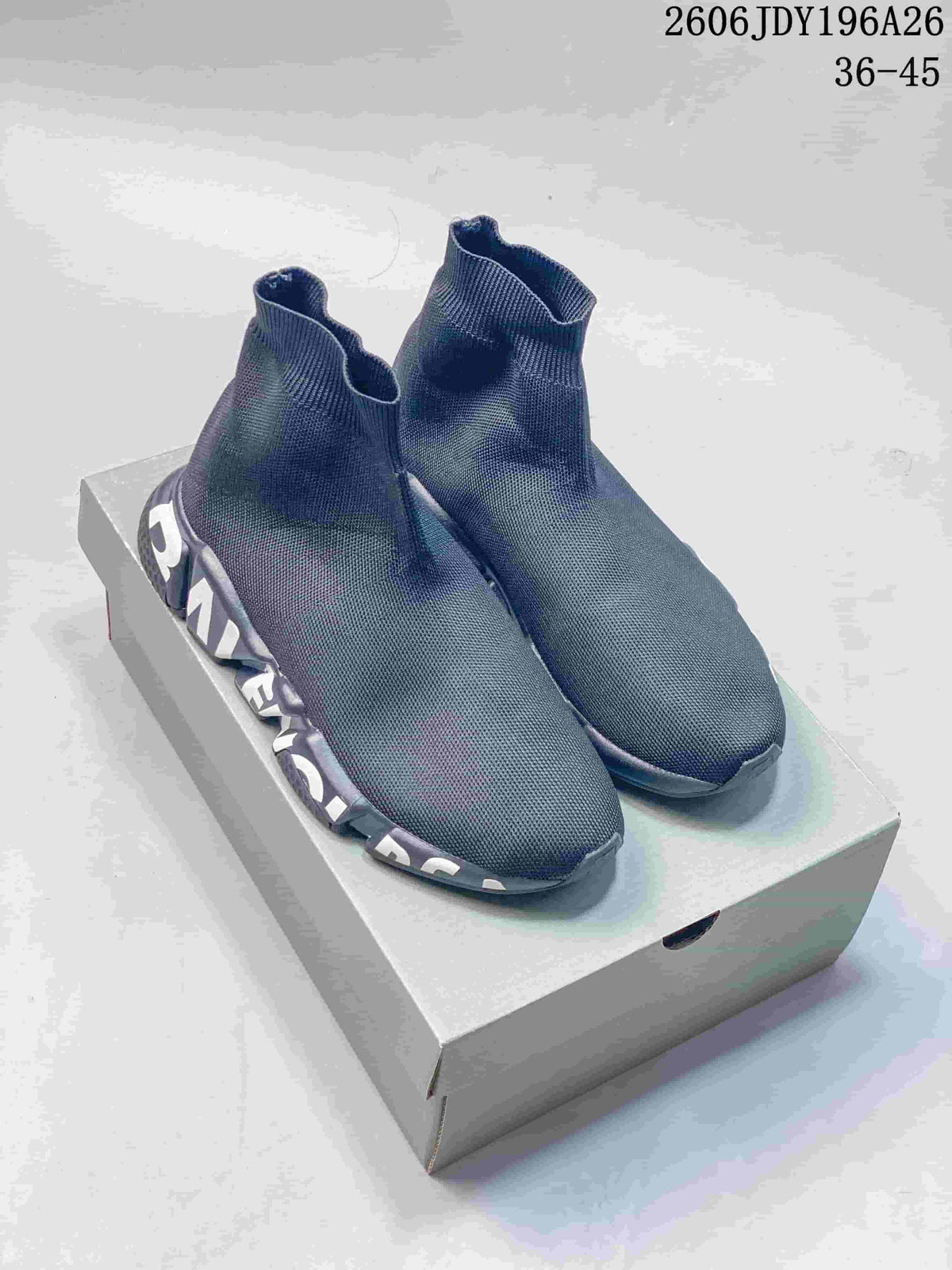 Pair of plain dark gray sock-style slip-on sneakers with large lettering along the soles.
