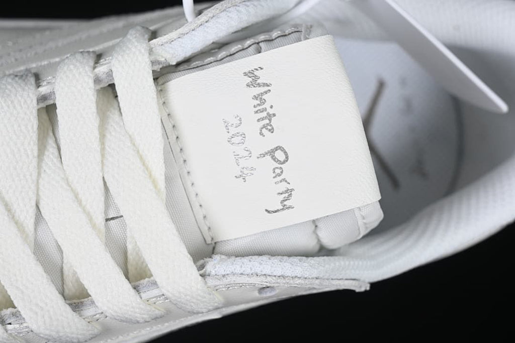 Close-up of the tongue label with handwritten-style White Party text.