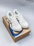 Pair of white and blue ASICS GEL-KAHANA 8 shoes displayed on a shoebox.