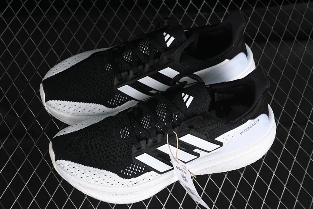 Pair of black and white Adidas Ultraboost 5 shoes