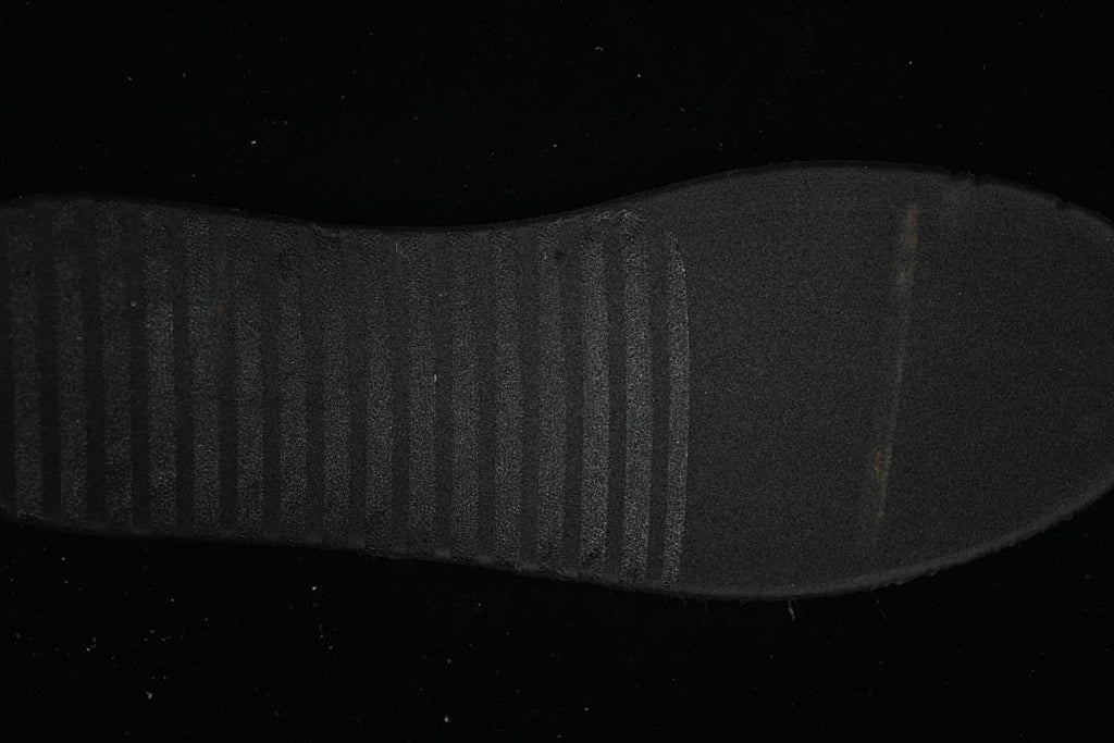 Close-up view of the black outsole tread.