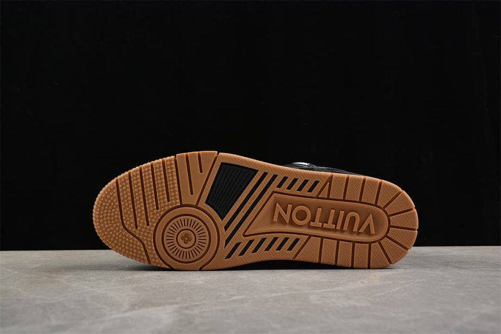 Bottom view showing the tan-colored tread and outsole pattern