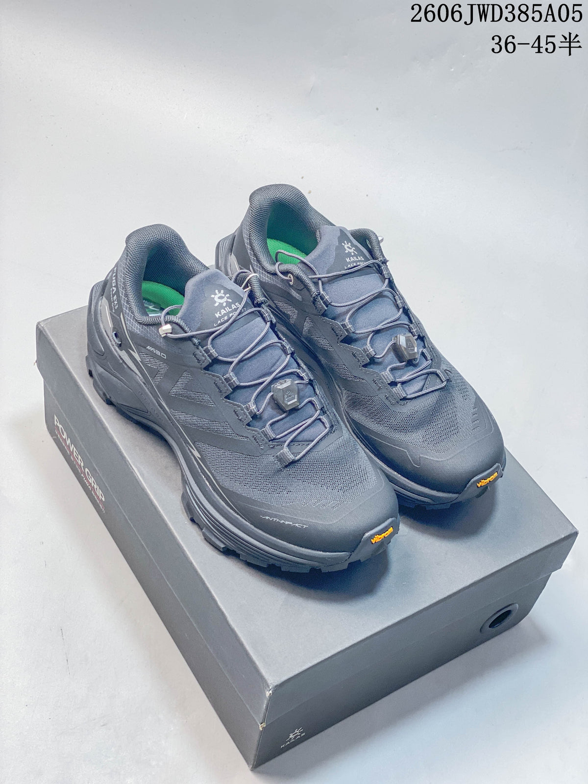 Pair of gray KAILAS Fuga Ex3 trail running shoes on a shoe box