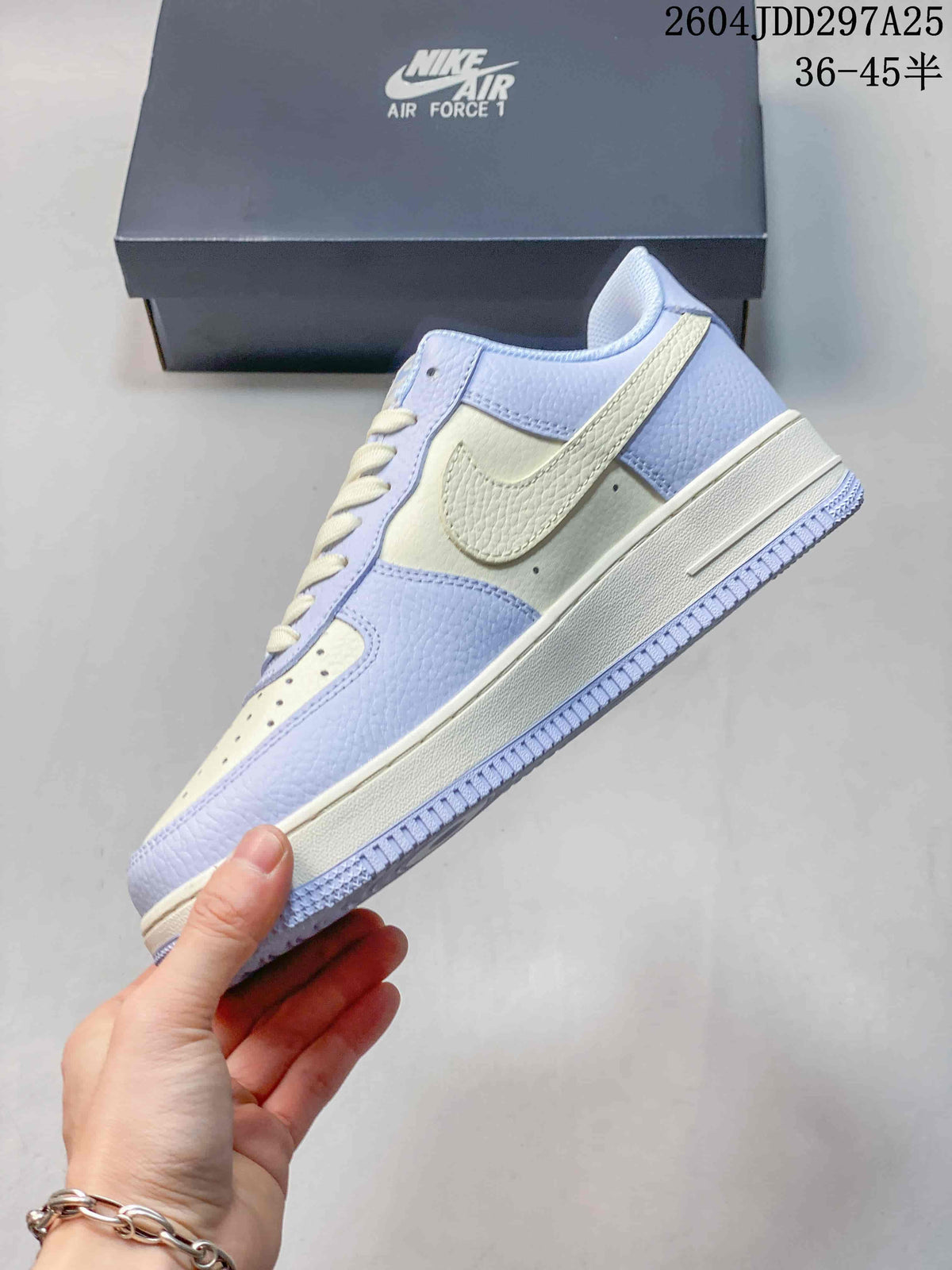 Side profile of a light blue and cream Nike Air Force 1 ’07 LV8 sneaker