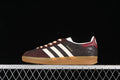 Side view of a burgundy and dark brown adidas Gazelle Indoor sneaker with off-white stripes and gum sole.