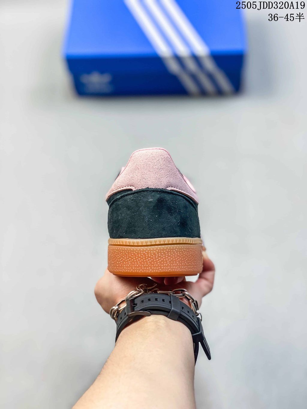 Rear view showing the dark heel, pink heel tab and gum outsole