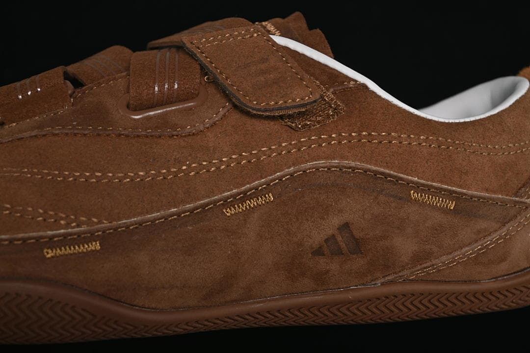 Close-up of the layered side panels, stitching, and strap fastening