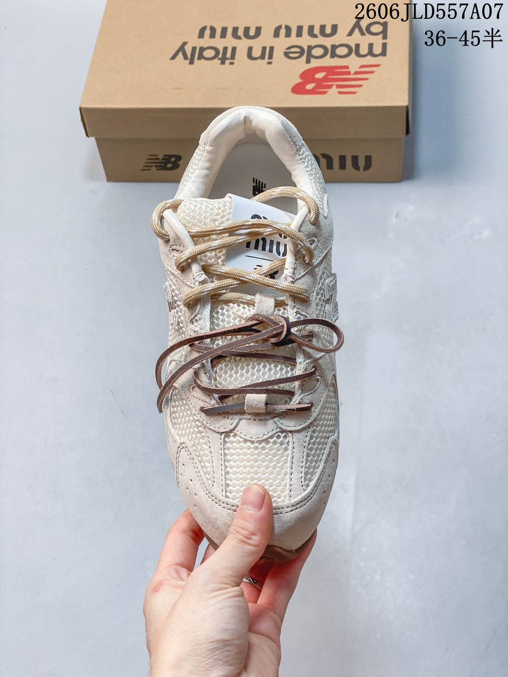 Top view showing the sneaker's layered lace details and textured upper.