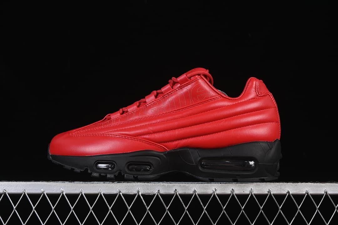 Side view of red and black Nike Air Max 95 Lux sneakers