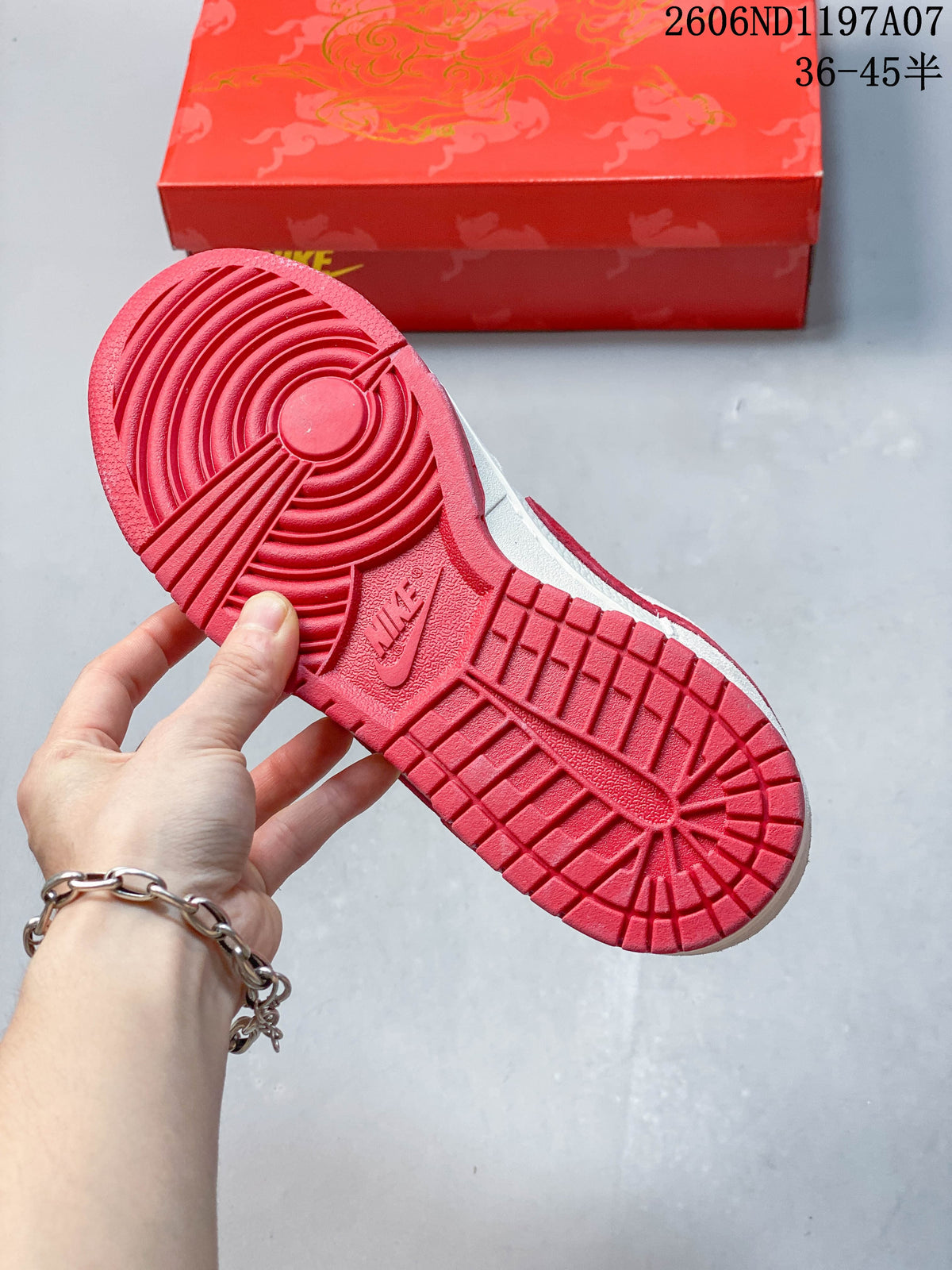 Red outsole with circular tread pattern on a Nike SB Dunk Low sneaker