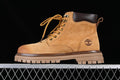 Side view of a wheat-brown Timberland mid-top lace-up boot with a lugged sole