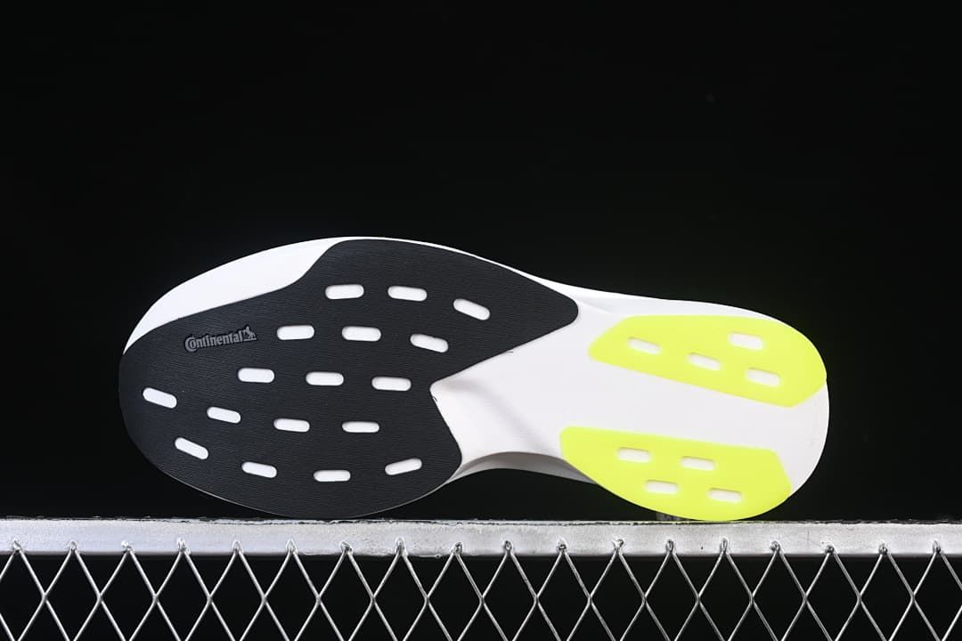 Outsole view with black, white, and lime sections and visible Continental branding.
