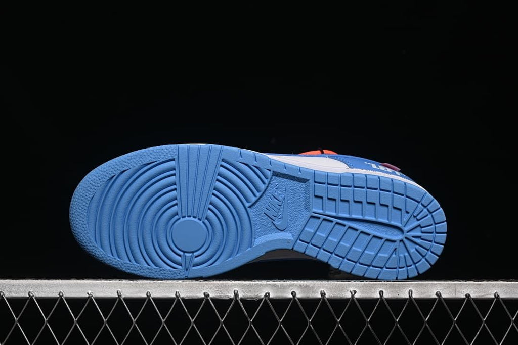 Underside view showing the blue patterned outsoles.