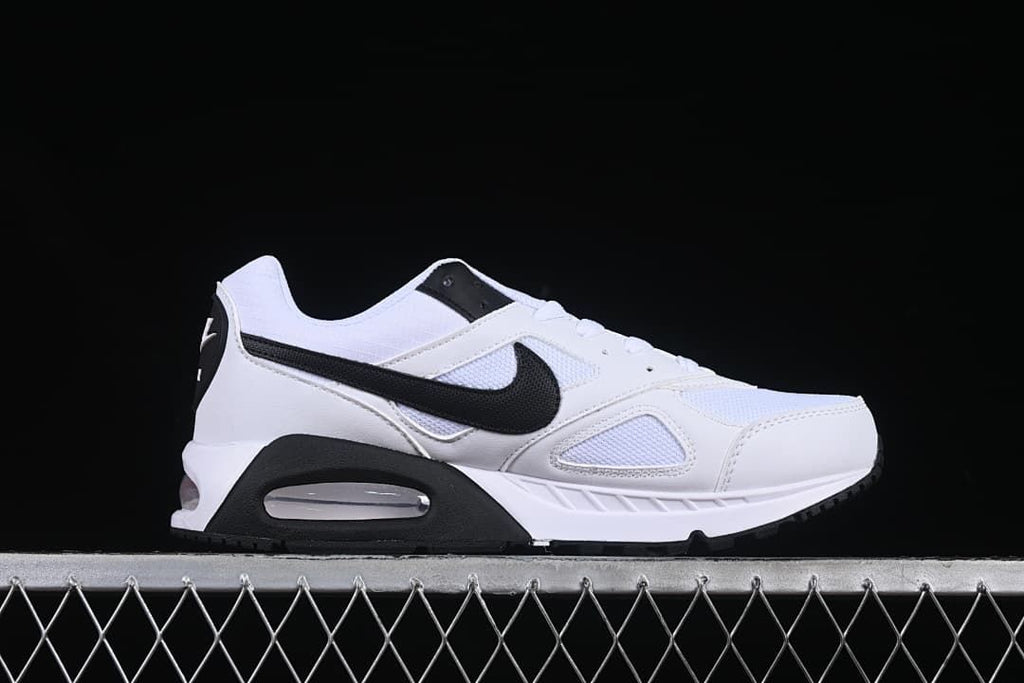 Side profile of a white and black Air Max Correlate sneaker.
