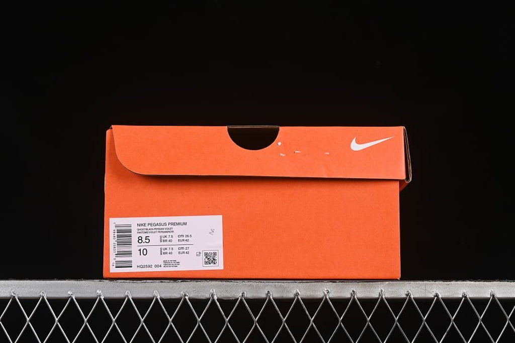 Orange shoe box label showing Nike Pegasus Premium and sample size information