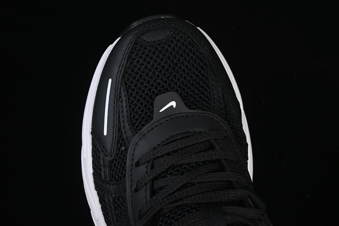 Top-down view of the black mesh toe and laces.