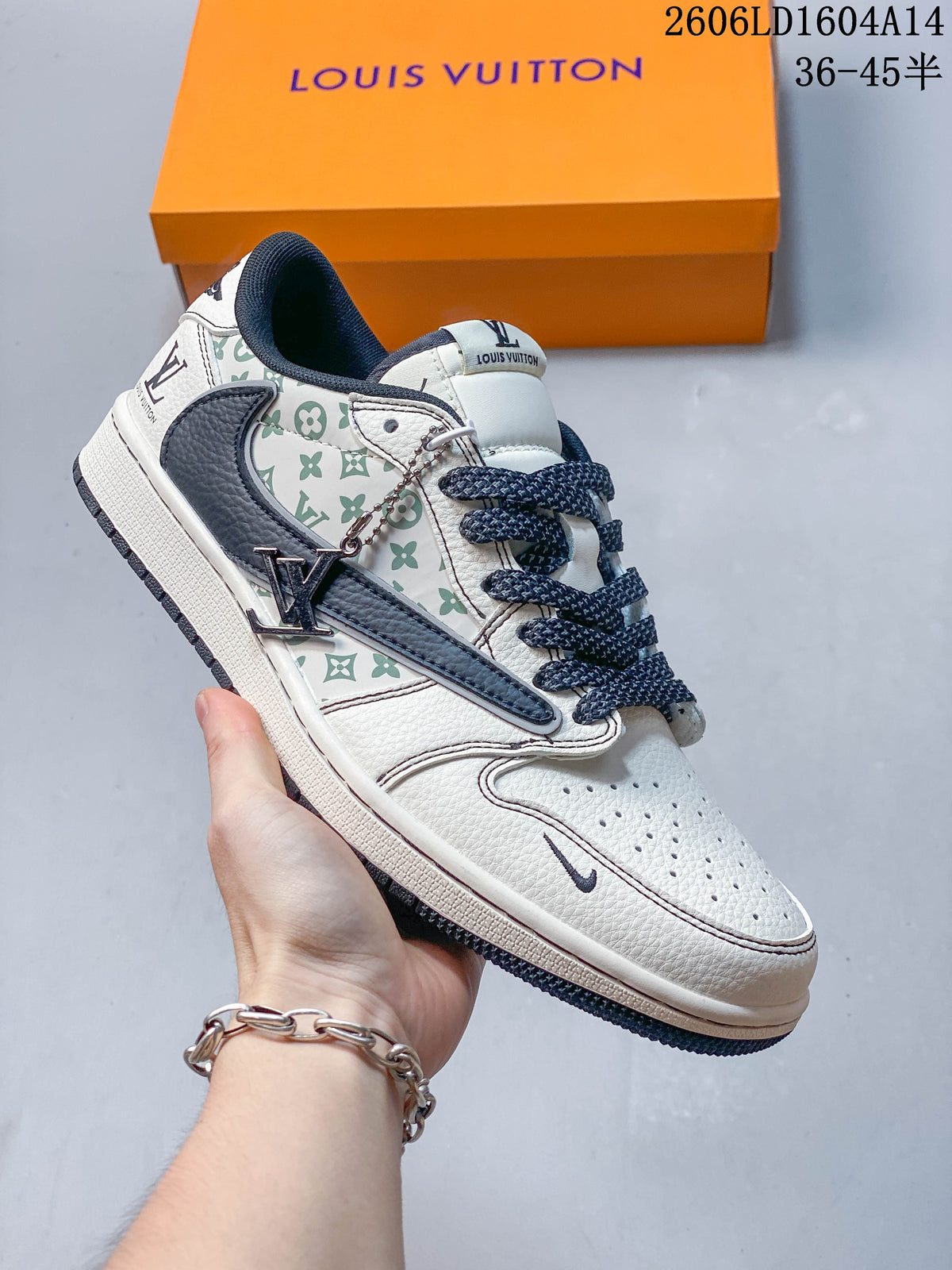 Side view of a white sneaker with green repeating motifs, navy accents, and a hanging metal charm